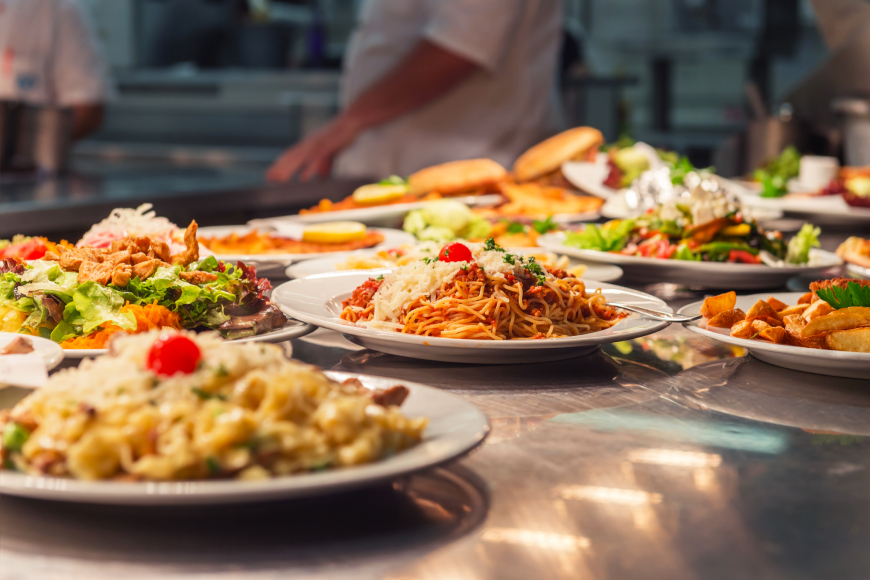 restaurant dishes lined up on kitchen counter