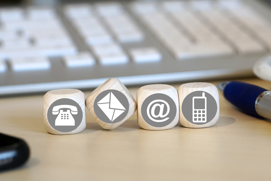 Various contact method symbols on wooden blocks