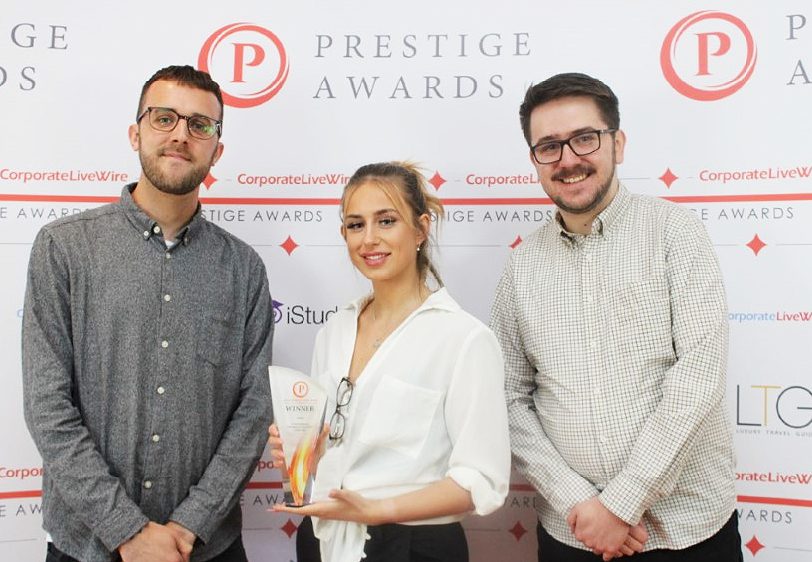 Our team members collecting our Prestige award