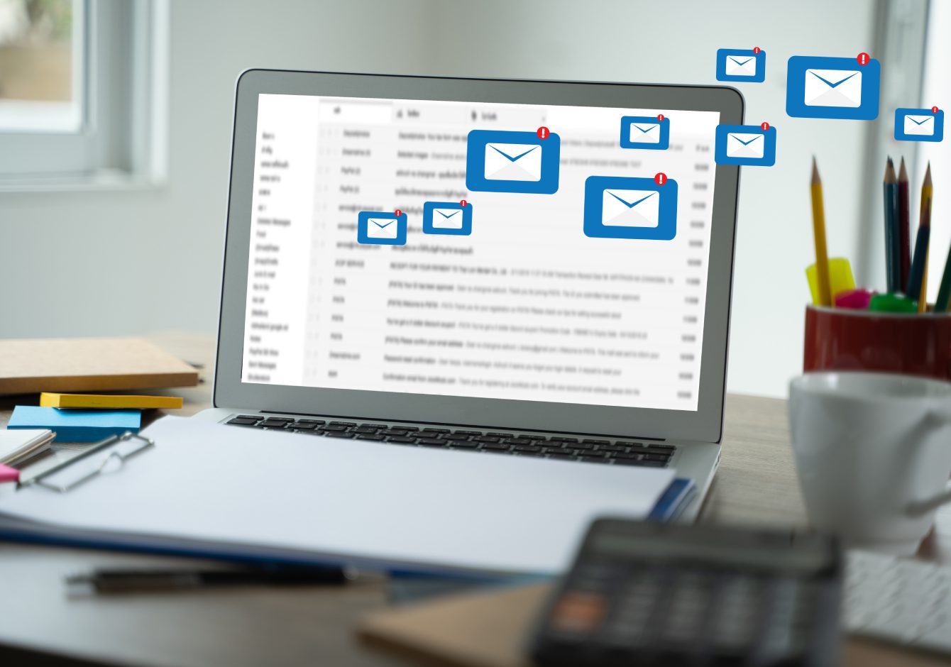 Laptop with inbox envelope message notifications