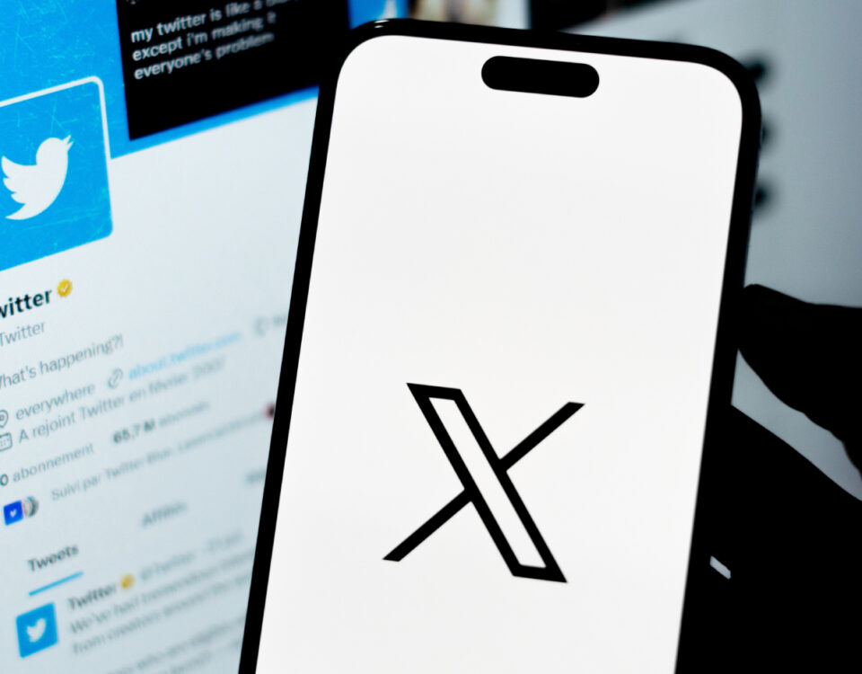 Smartphone with X logo on screen