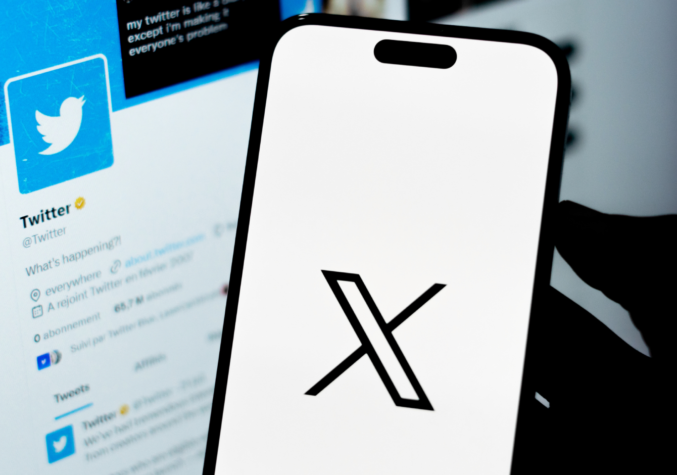 Smartphone with X logo on screen