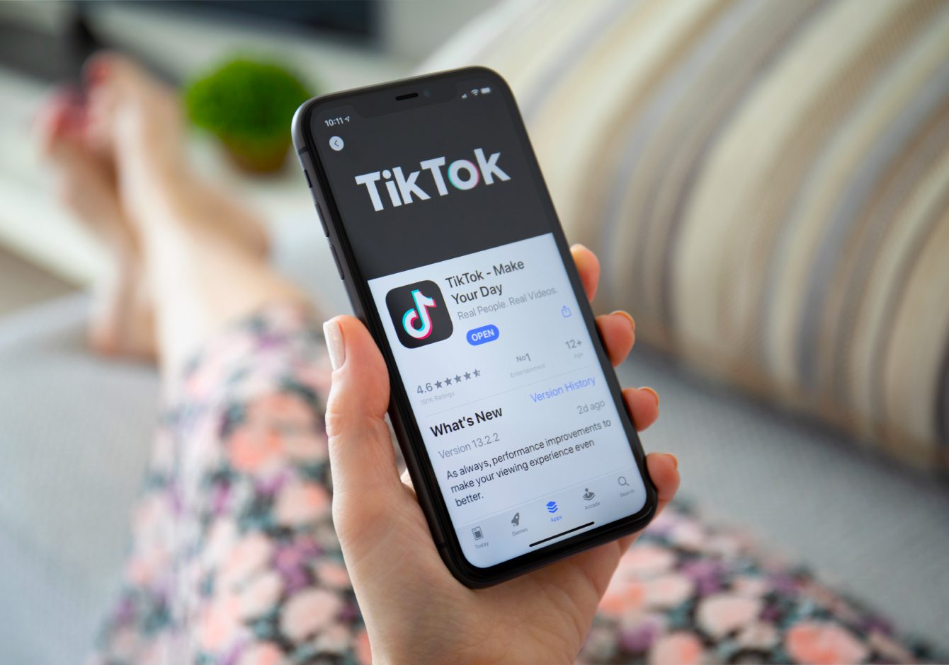 Woman using TikTok on smartphone