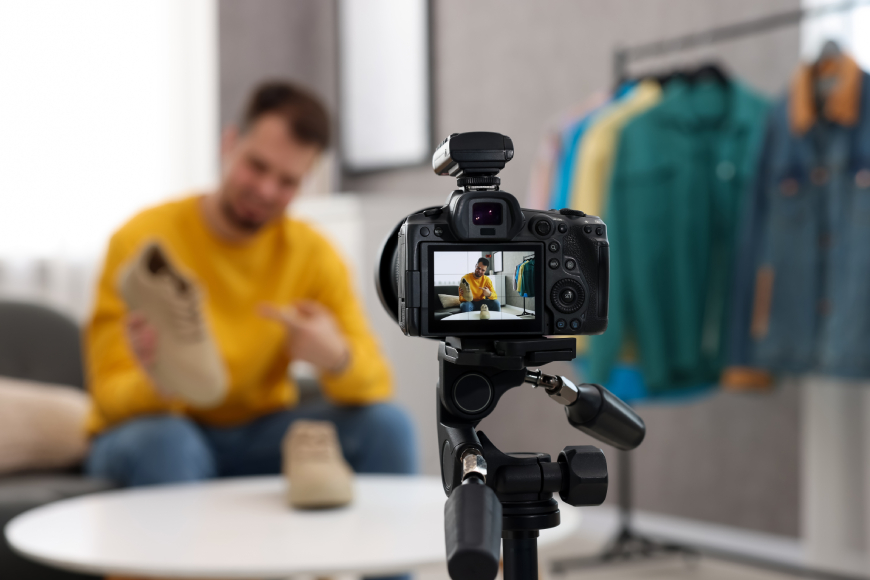 Male fashion influencer showing shoes on camera