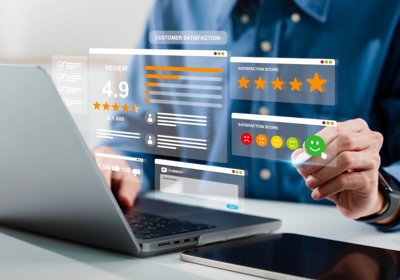 Person sitting at desk with laptop choosing customer satisfaction rating