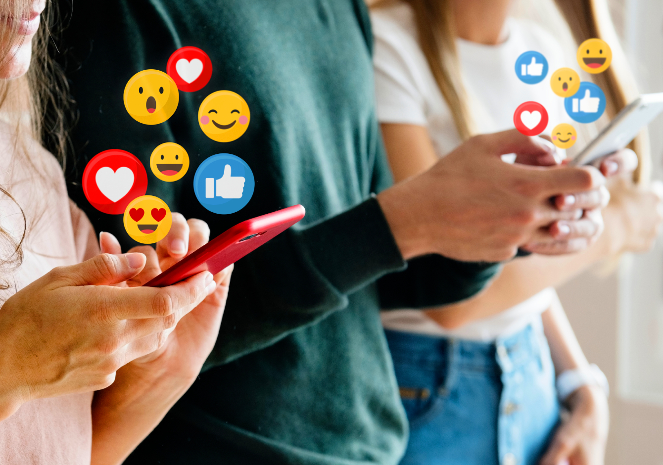 Row of people holding smartphones with social media reaction emojis around the screens