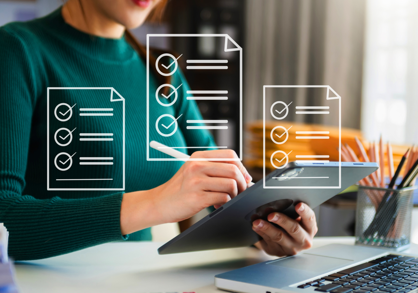 Woman sitting at desk using iPad tablet with stylus pen and white document icons overlaid